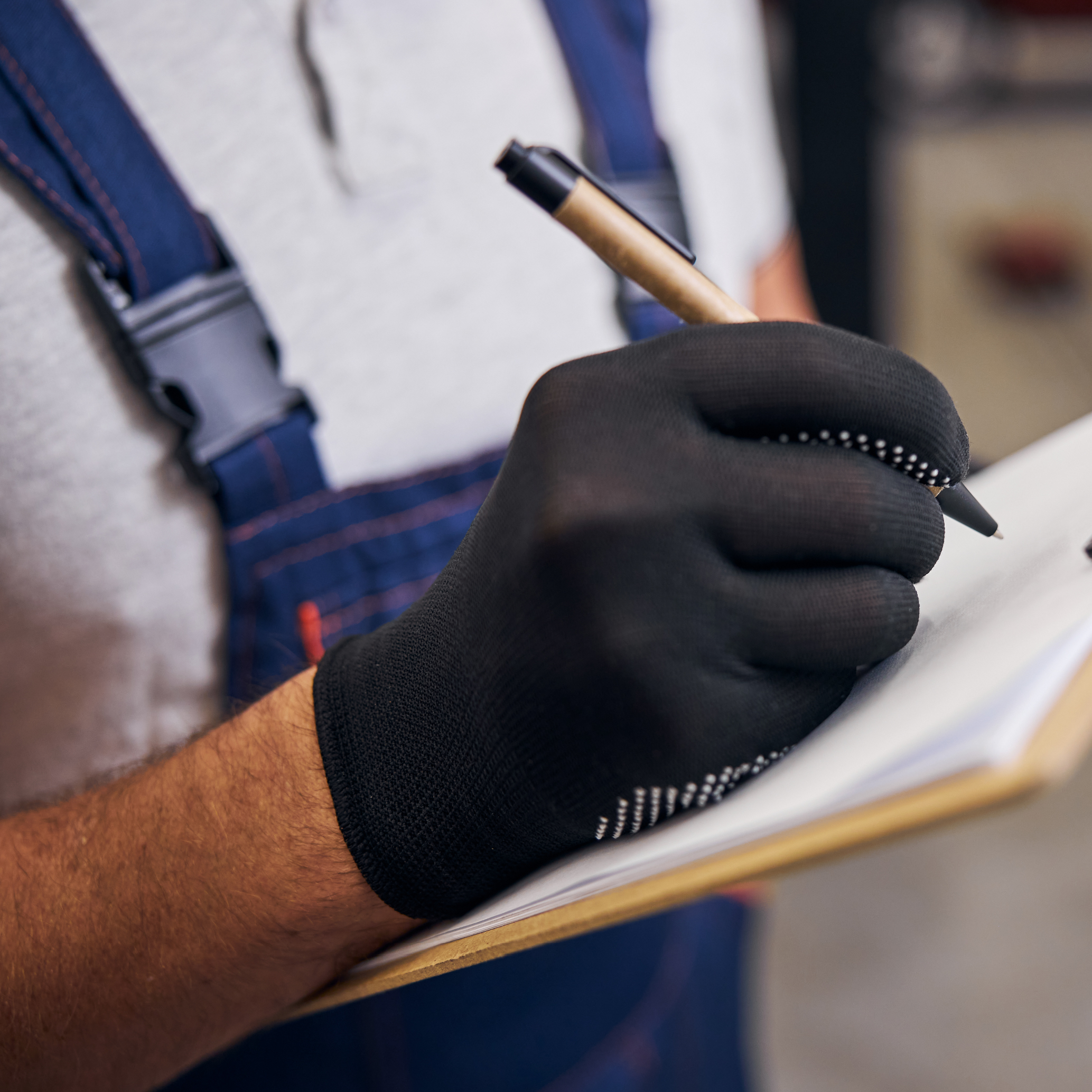 auto-mechanic-writing-clipboard-service-station